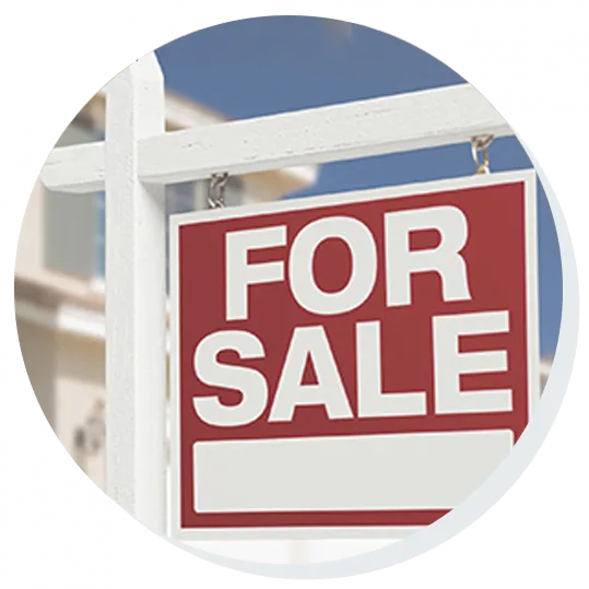 House with 'For Sale' signboard